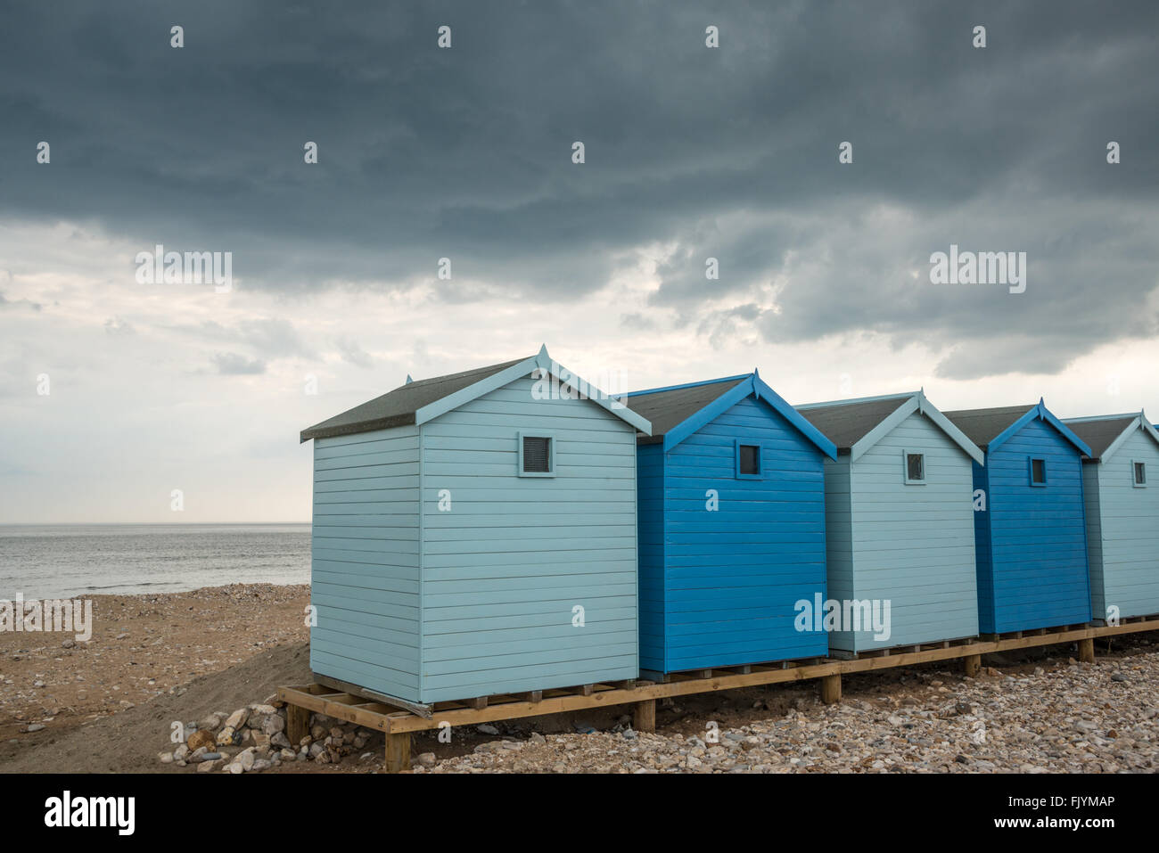 Strandhütten bei Charmouth, Dorset Stockfoto