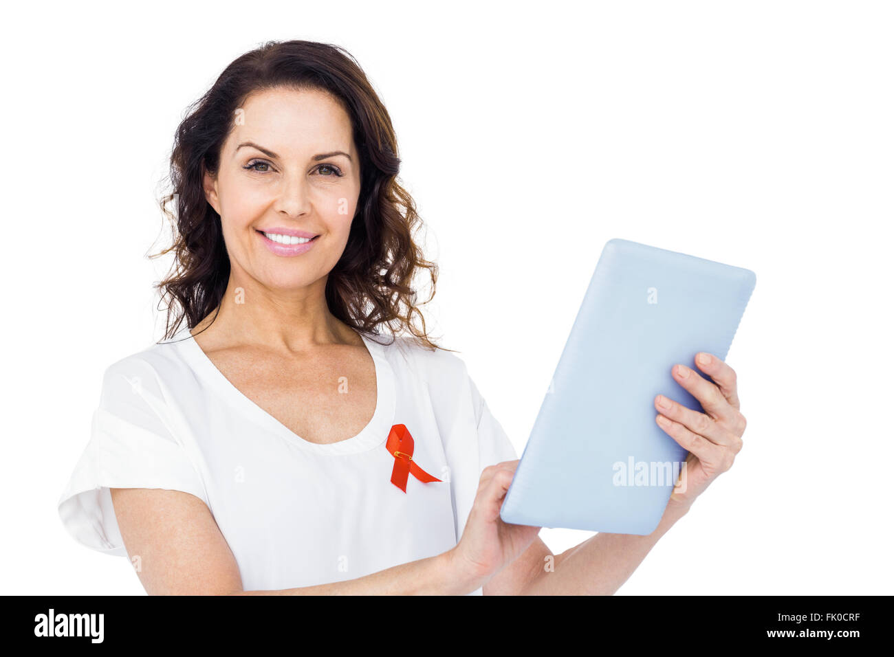 Frau mit roten Aids-Schleife mit tablet Stockfoto