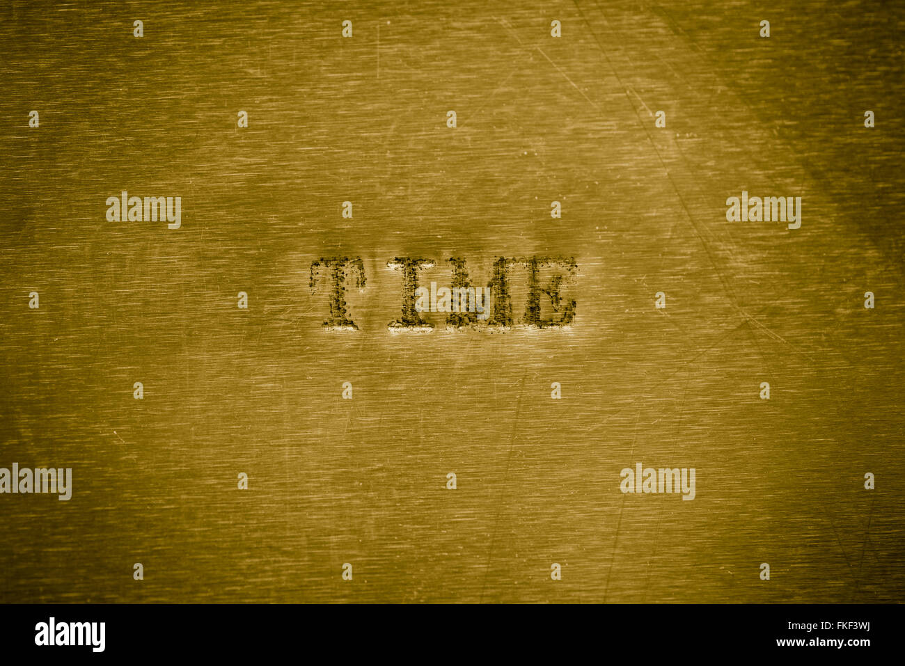 Wort Zeit gedruckt auf Goldgrund metallische Textur Stockfoto
