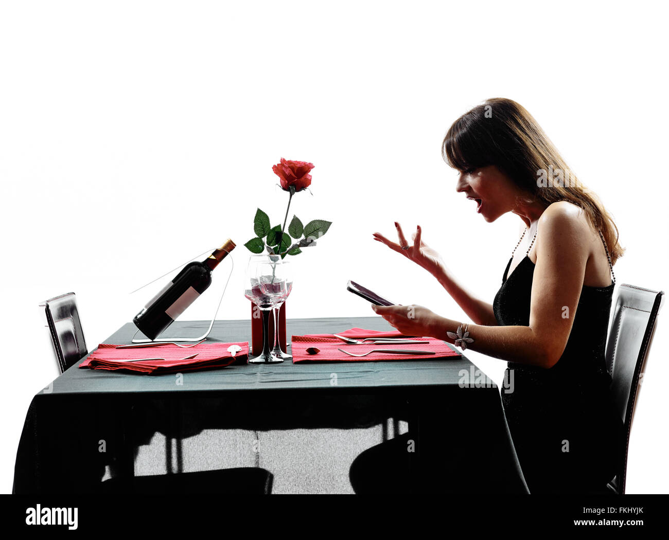 eine Frau wartet, Ess in Silhouetten auf weißem Hintergrund Stockfoto