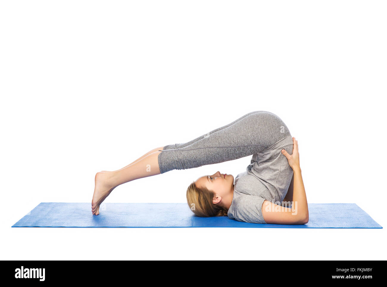 Pflug-Pose auf Matte Yoga bei Frau Stockfoto