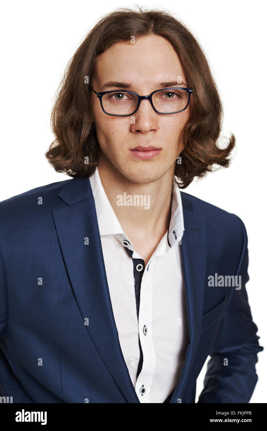 Porträt eines jungen Mannes in einem blauen Anzug, isoliert auf weiss Stockfoto