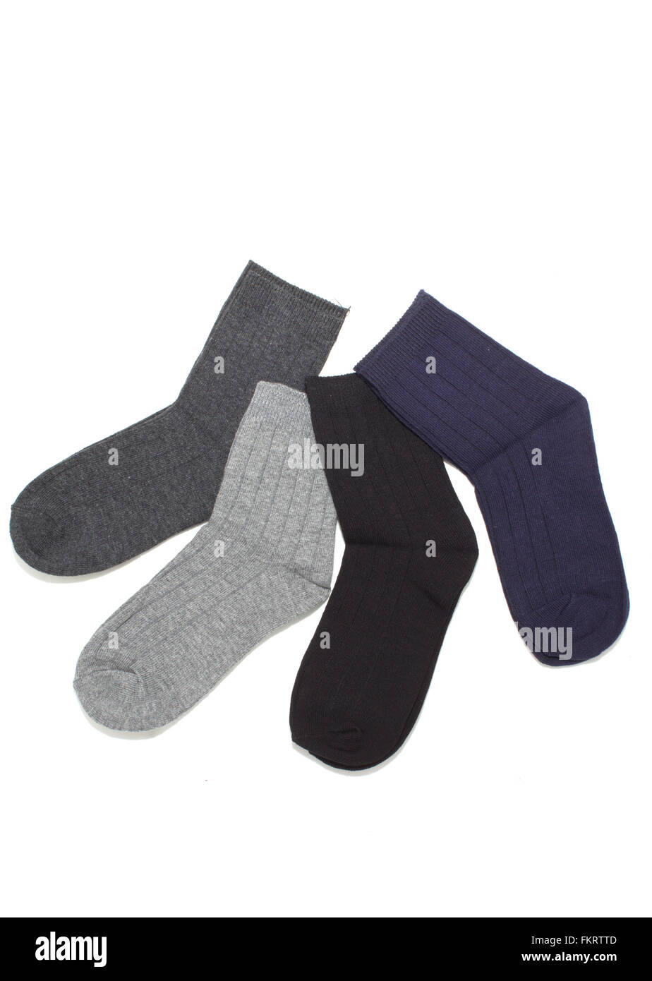 Vier Paare von grauen Socken, isoliert auf weiss Stockfoto