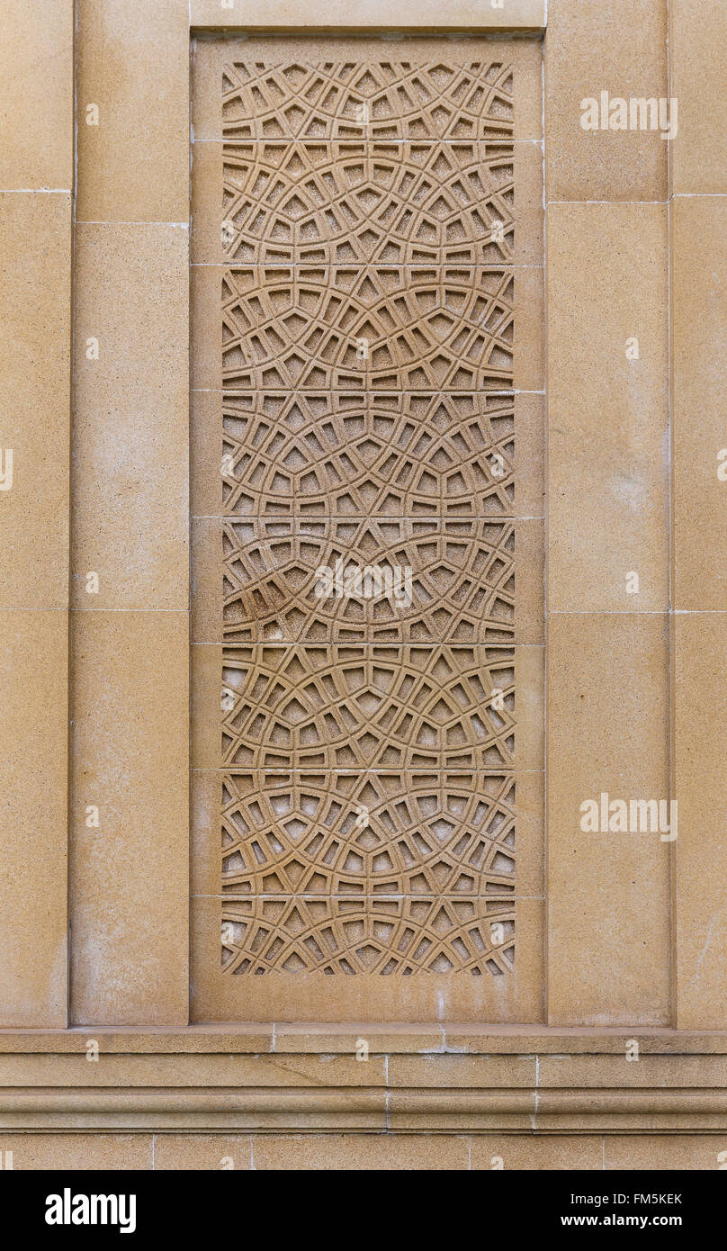 Orientalische Muster auf der Steinmauer Stockfoto