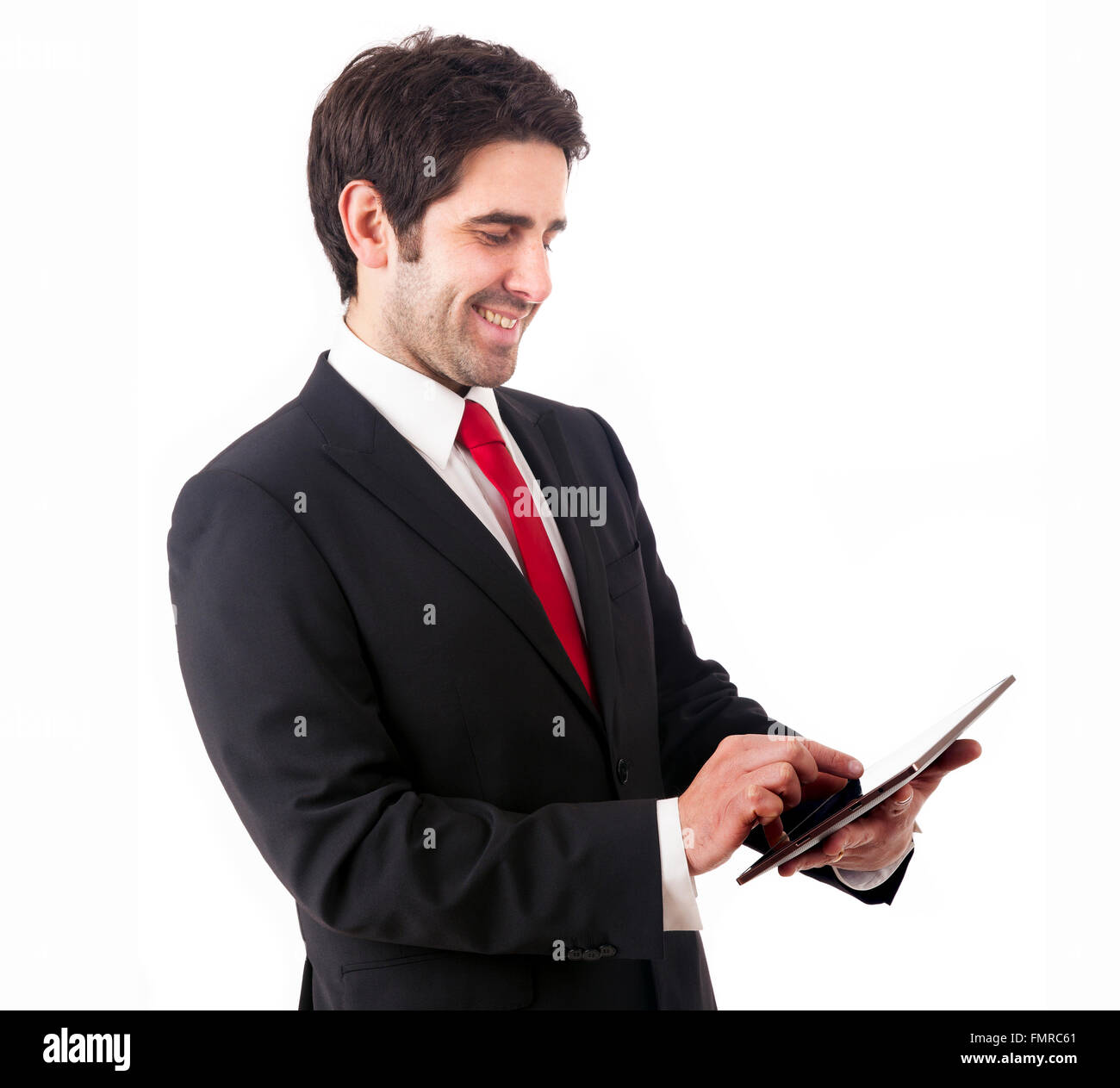 Gut aussehend lächelnd Geschäftsmann mit Tablet-Computer. Isoliert auf weißem Hintergrund Stockfoto