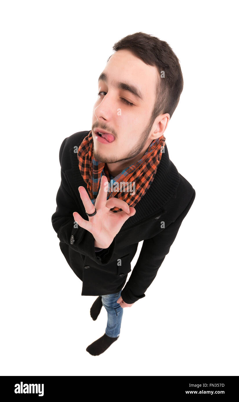 Junger Mann im schwarzen Kleid zu zeigen Gesten OK, isoliert auf weißem Hintergrund Stockfoto