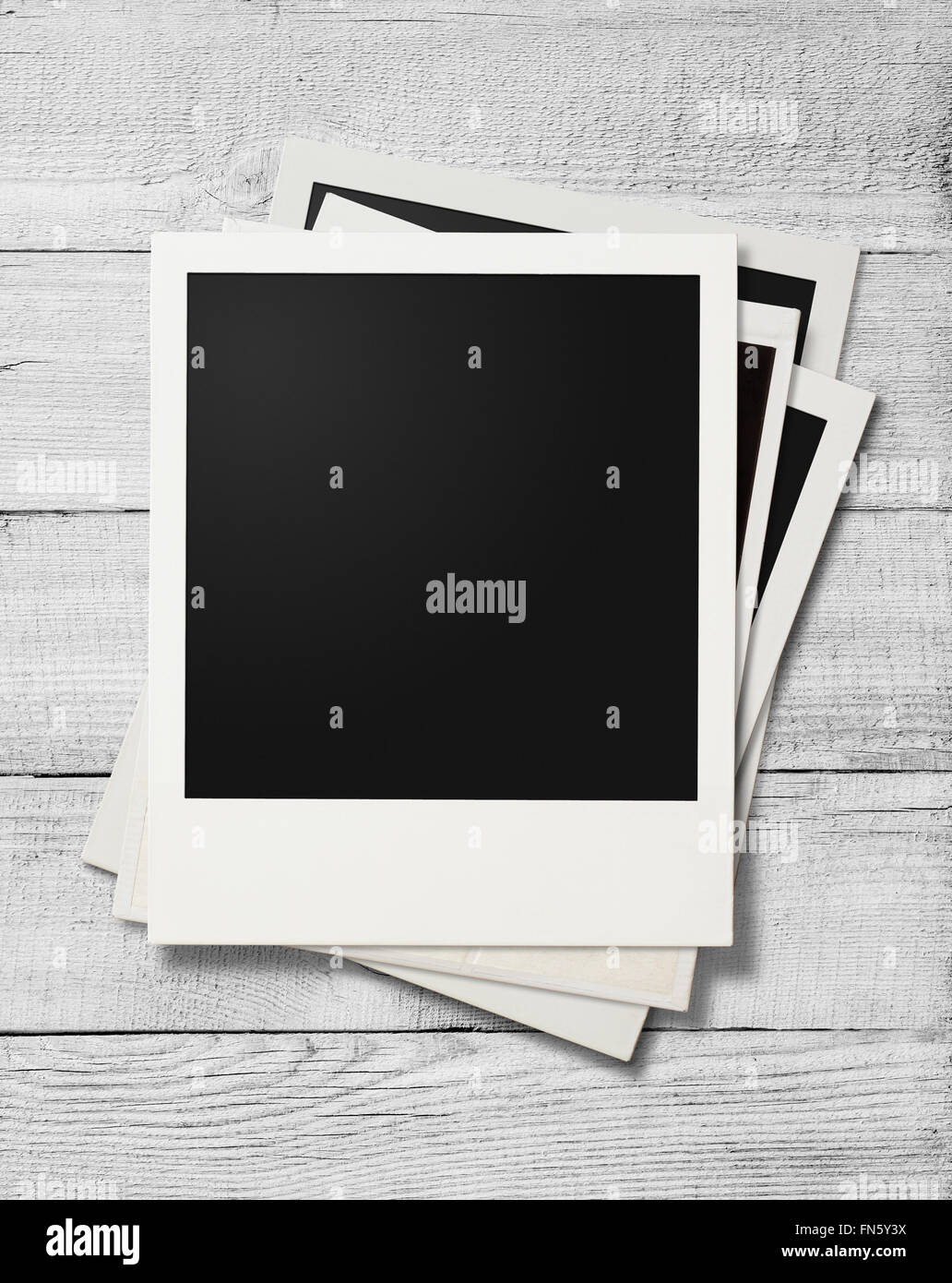Polaroid-Foto-Rahmen auf weißem Holz Hintergrund Stockfoto