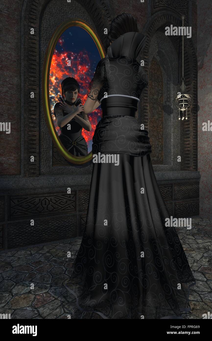 Schön böse Stiefmutter in langen schwarzen Kleid mit hohem Kragen starrt ihr Spiegelbild im Zauberspiegel Stockfoto