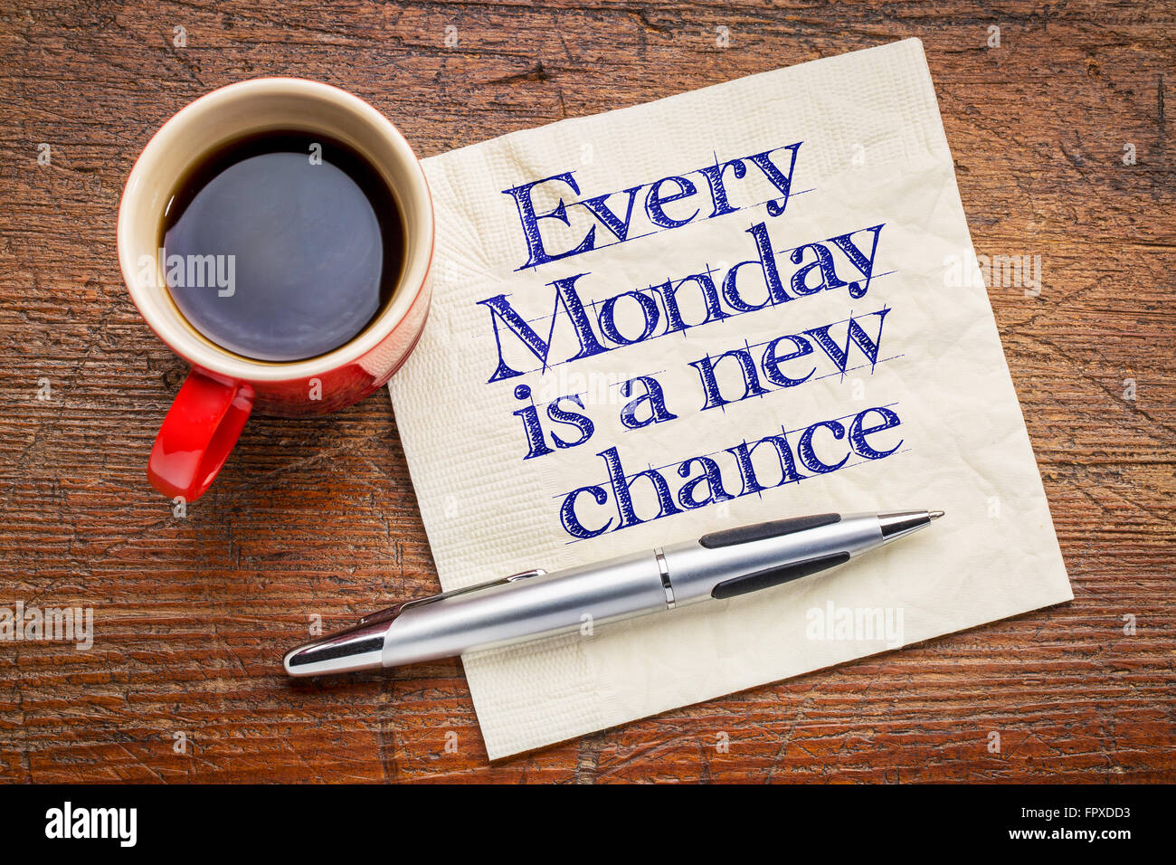 Jeden Montag ist eine neue Chance - motivierende Handschrift auf Serviette mit einer Tasse Kaffee Stockfoto