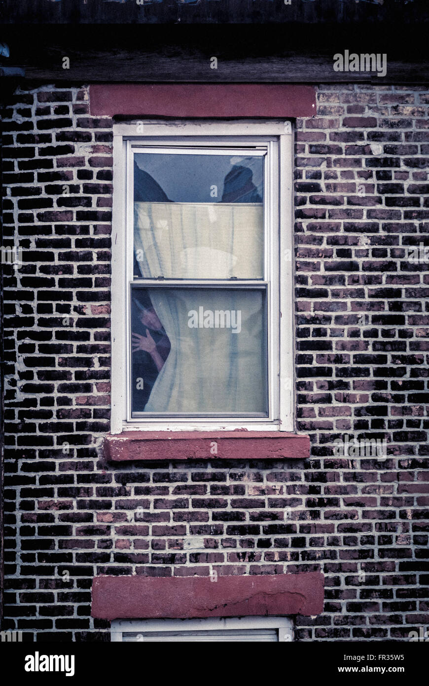 Gesicht aus Fenster, New York City, USA. Stockfoto