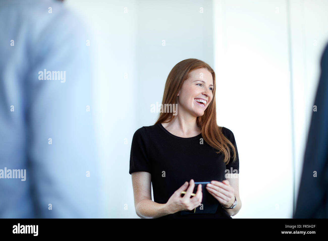 Lachende Geschäftsfrau Stockfoto