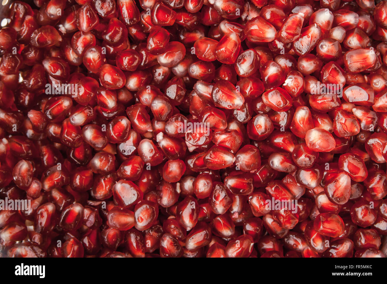 Muster der horizontale rote Granatapfelkerne Stockfoto
