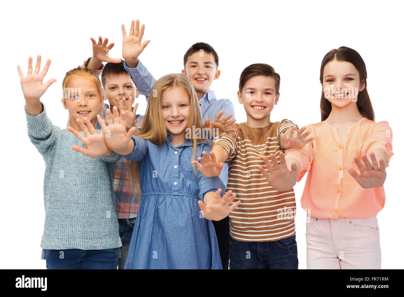 glückliche Kinder winken Hände Stockfoto