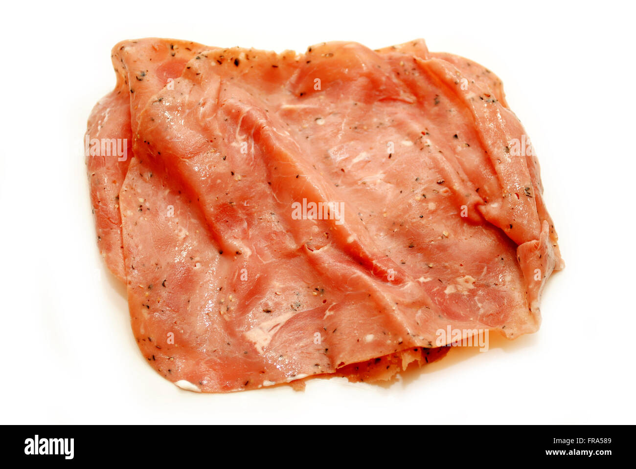 Pastrami Frühstücksfleisch isoliert auf weißem Hintergrund Stockfoto