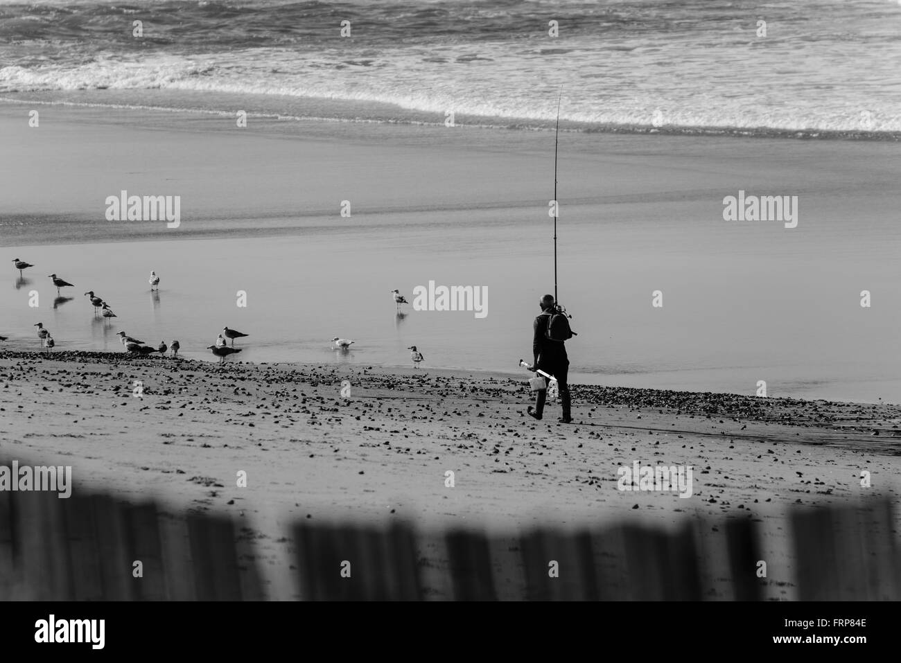 Fischer am Strand zu Fuß Stockfoto