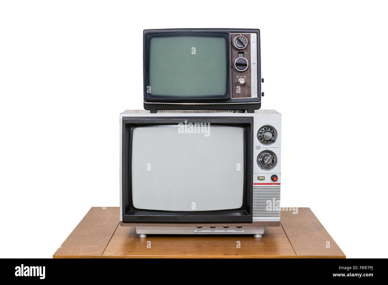 Vintage TV Stack auf alten Holztisch, isoliert auf weiss. Stockfoto