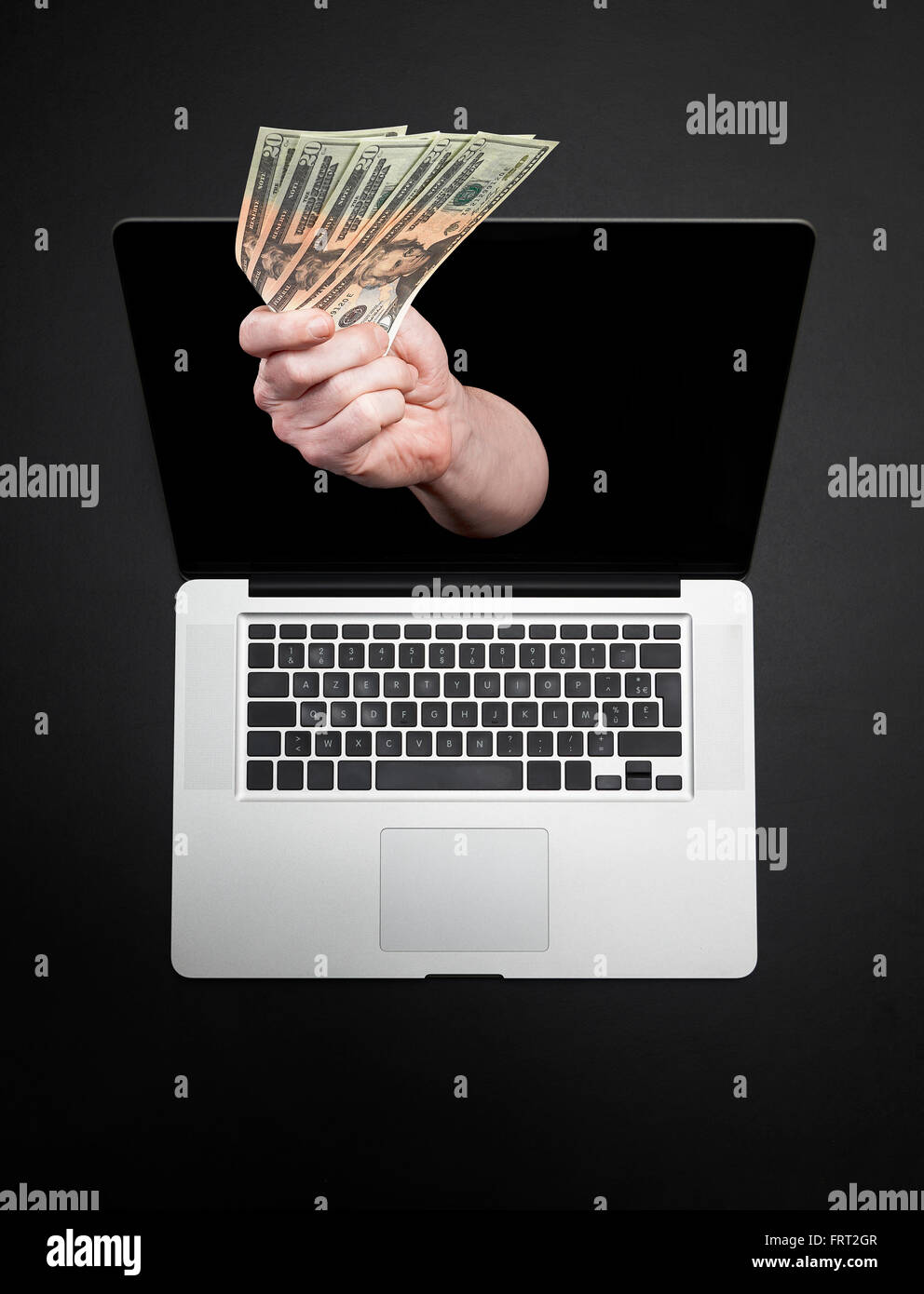 Immer Geld von Laptop-Monitor - Online-Buchung, Online-Banking Bildschirmthema. Stockfoto