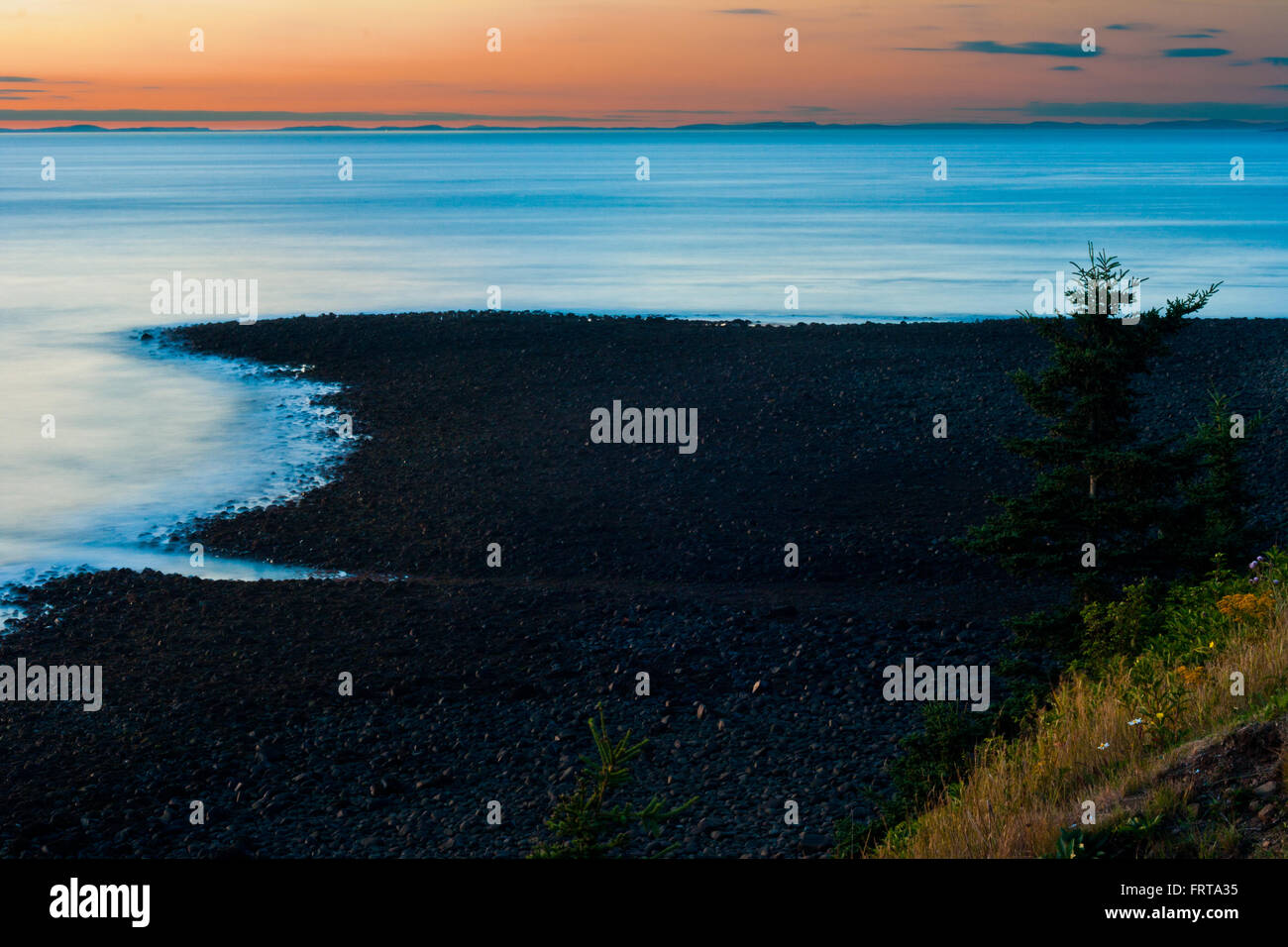 Bay Of Fundy Flut bei Sonnenuntergang. Die Pfeife auf Grand Manan Island. Stockfoto