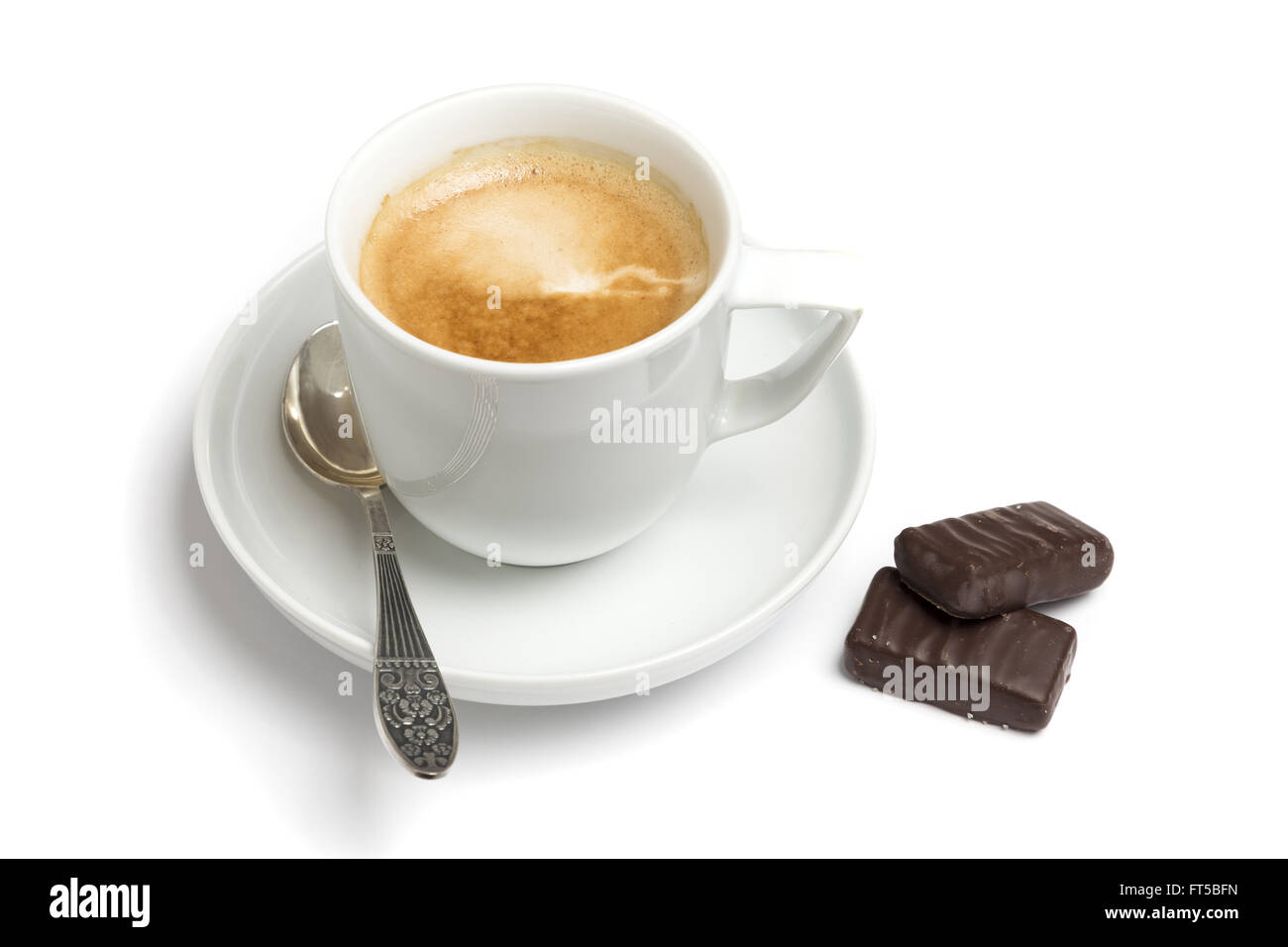Tasse Kaffee mit Pralinen Stockfoto