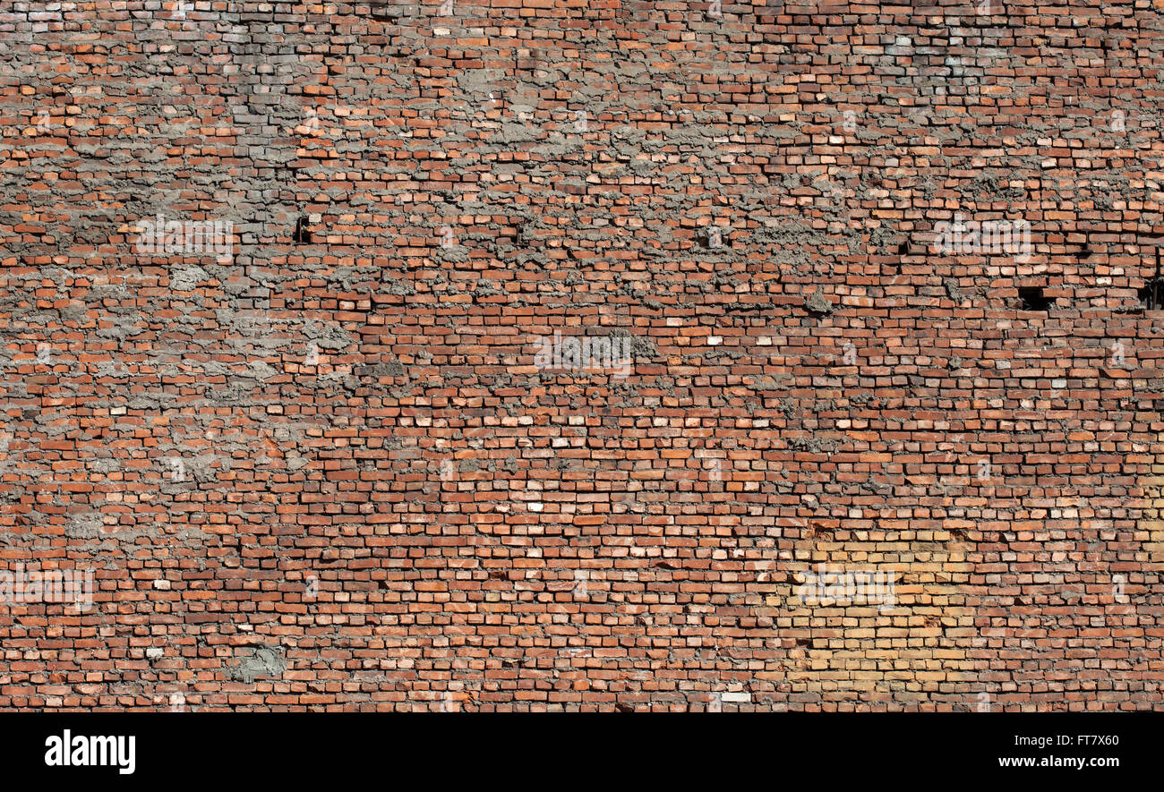 Textur der alten Grunge verschmutzte Ziegelwand mit peeling Putz Stockfoto