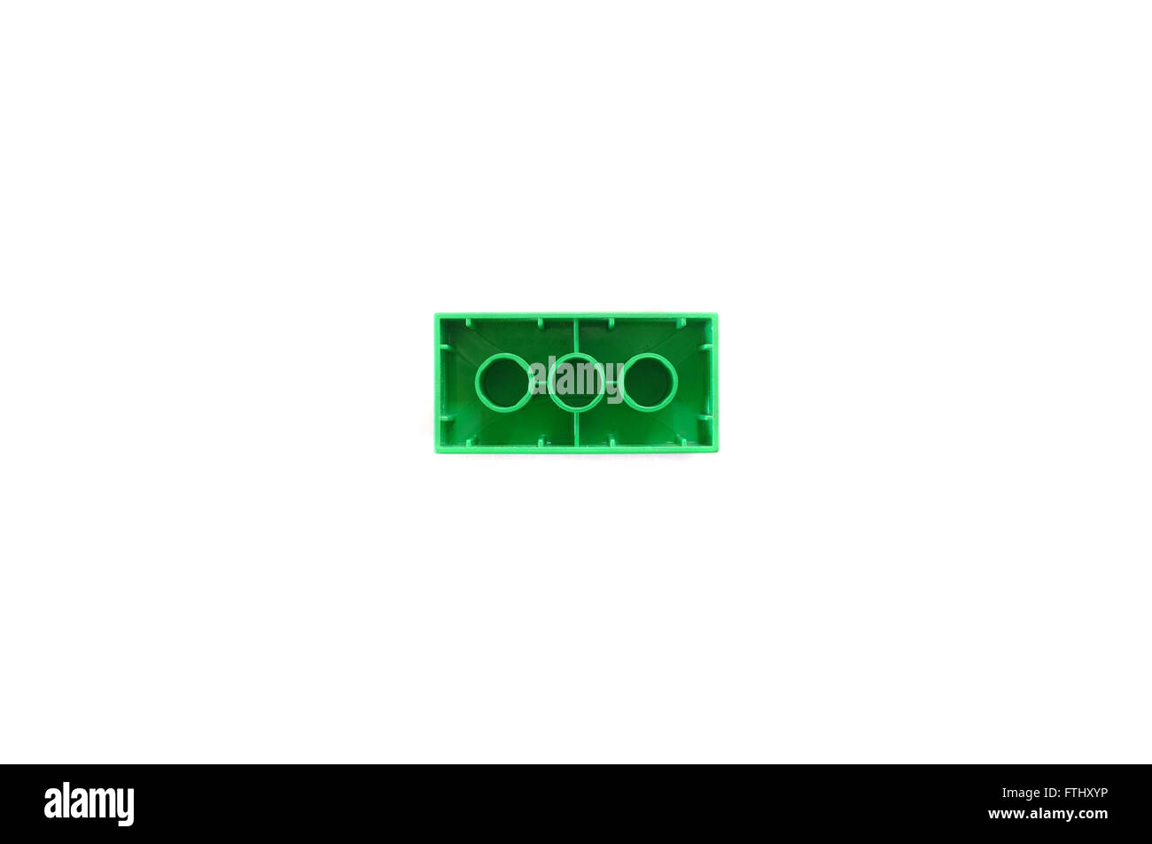 Eine Ansicht von unten der grünen 2 X 4 Lego-Stein vor weißem Hintergrund  fotografiert Stockfotografie - Alamy