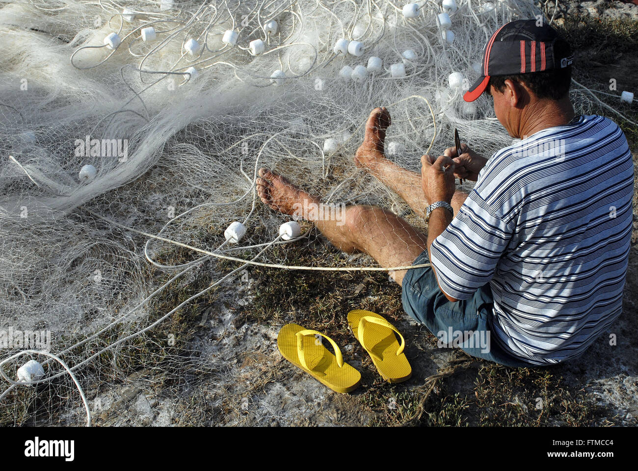 Fischer im Netz - Stadt Fox ausbessern Stockfoto