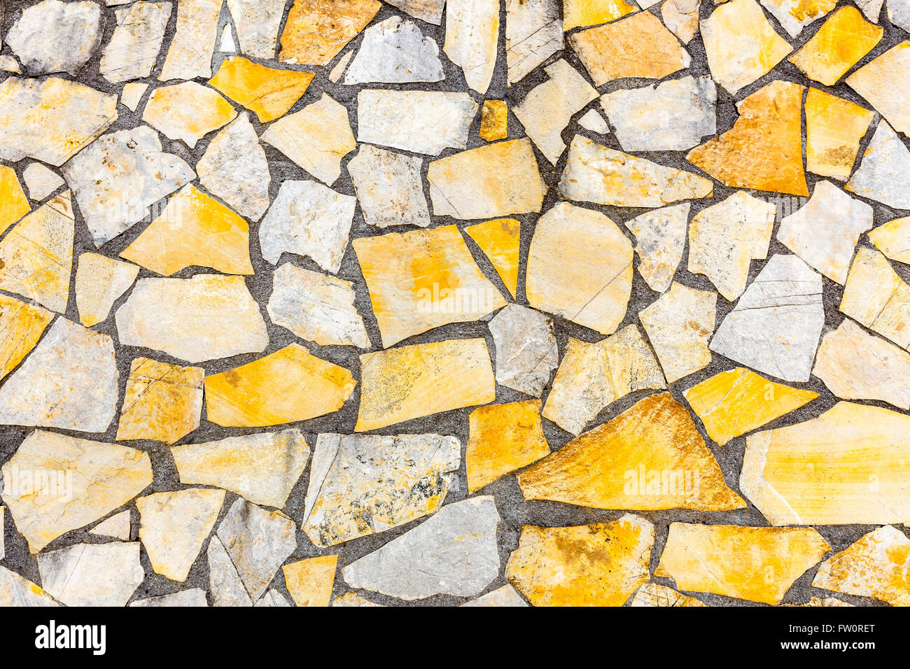 Verschiedene Formen von Steinen Mauerwerk oder Mauerwerk als Hintergrundwand Stockfoto