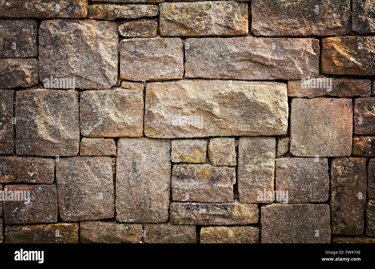 Bild der Mauer aus Naturstein. Zusammenfassung Hintergrund. Stockfoto