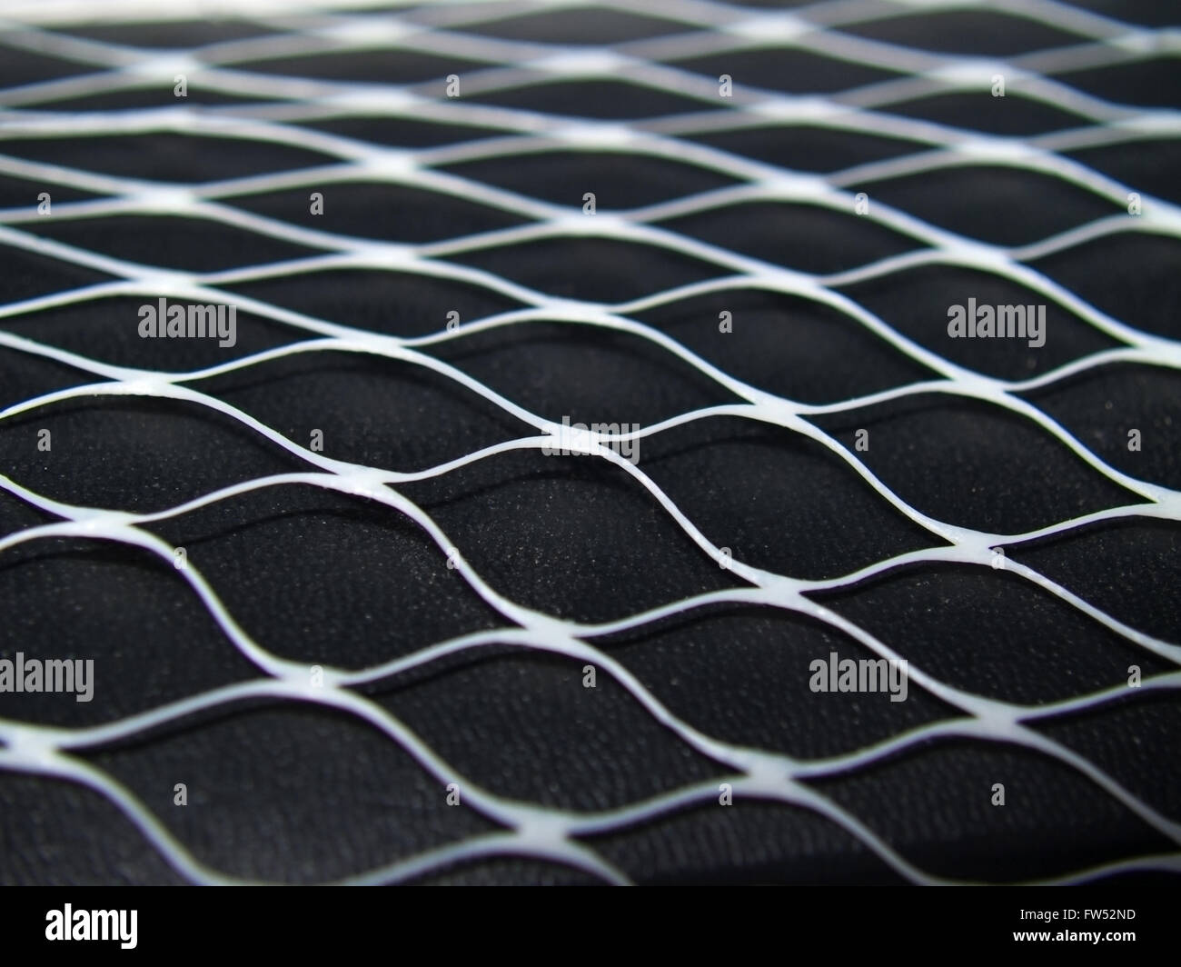Weiß net auf schwarzem Lederoberfläche Stockfoto