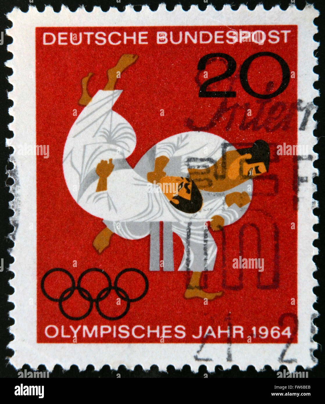 Deutschland - CIRCA 1964: Eine Briefmarke gedruckt in Deutschland zeigt Kampf der beiden Sportler, ca. 1964. Stockfoto