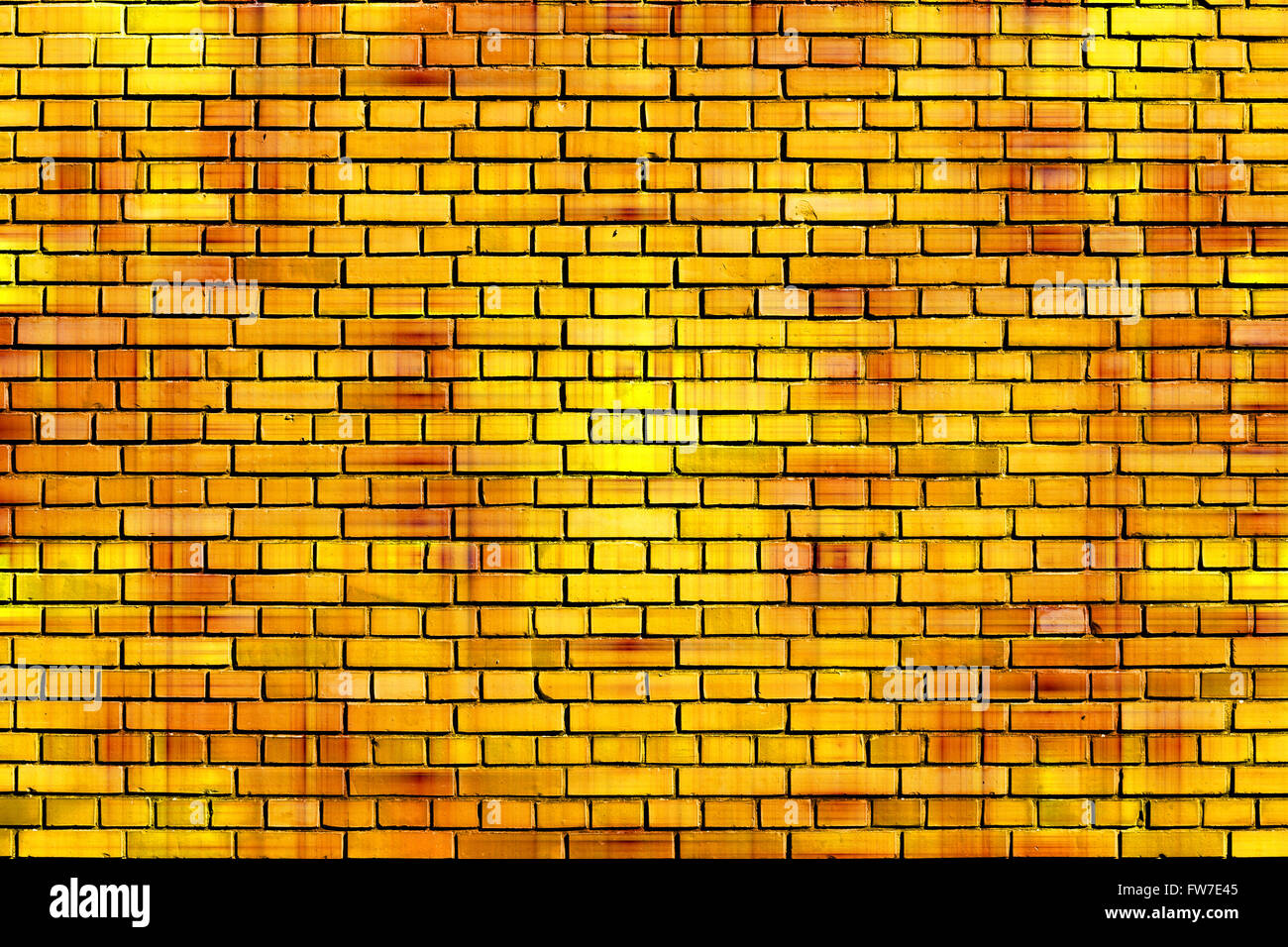 gelbe Ziegel Wand Hintergrund Stockfoto