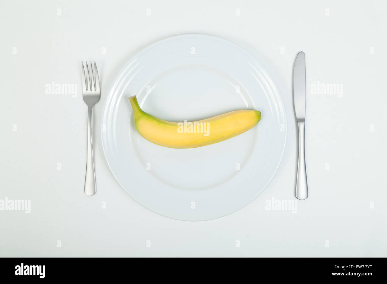 Banane auf Platte Stockfoto