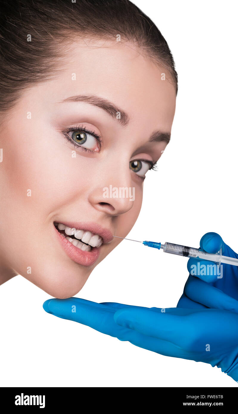 Junge Frau, die immer kosmetischen Einspritzung Stockfoto