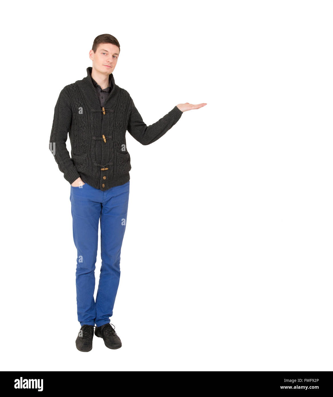 Hübscher junger Mann mit offener Handfläche Stockfoto