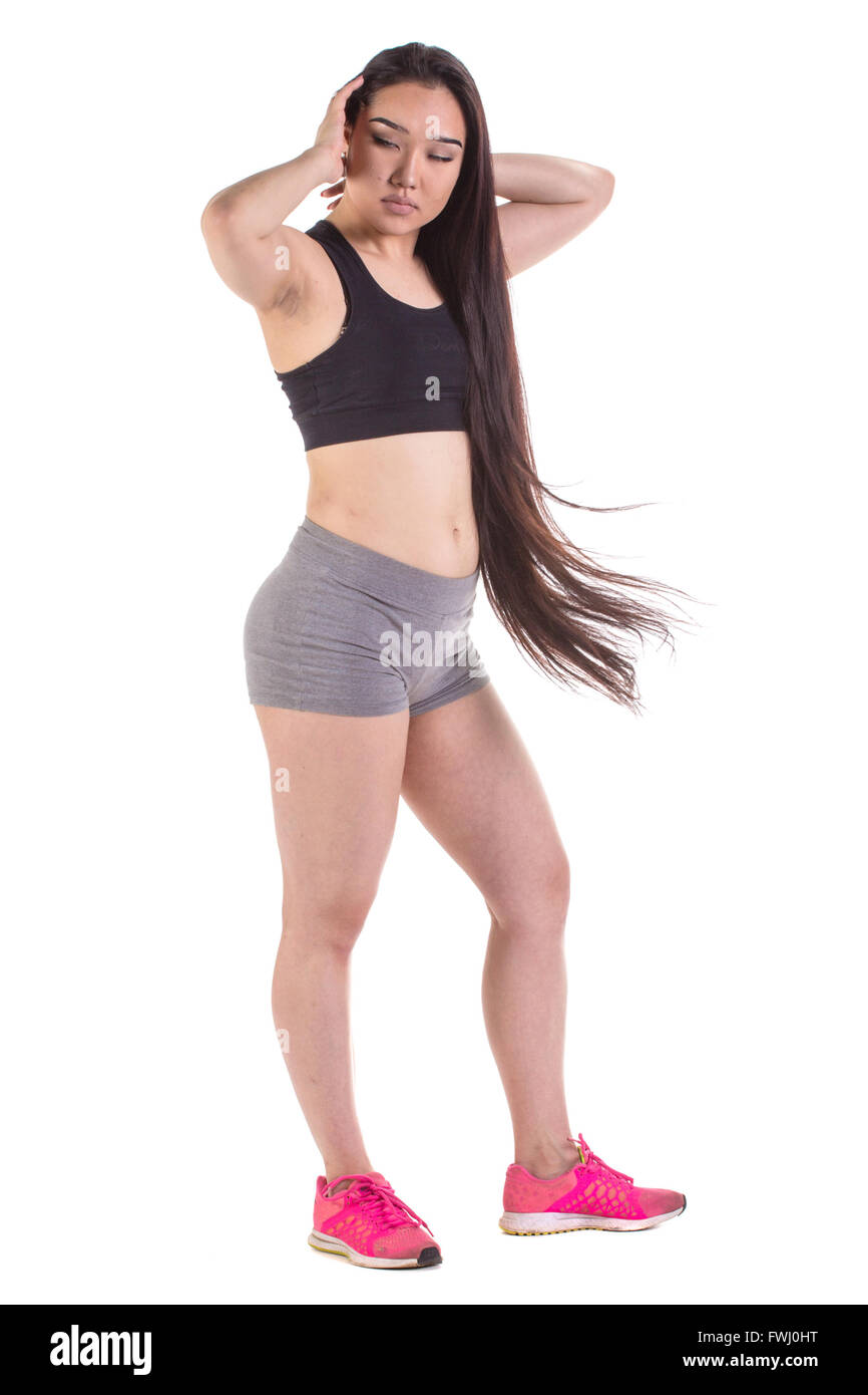 Orientalische Frau schöne Fitness stehen - auf einem weißen Hintergrund isoliert Stockfoto