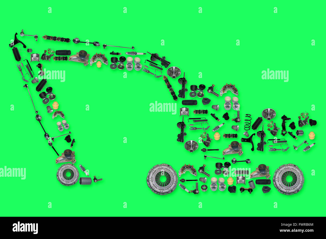 Viele Ersatzteile neue in Form von Bagger auf grünem Hintergrund isoliert Stockfoto