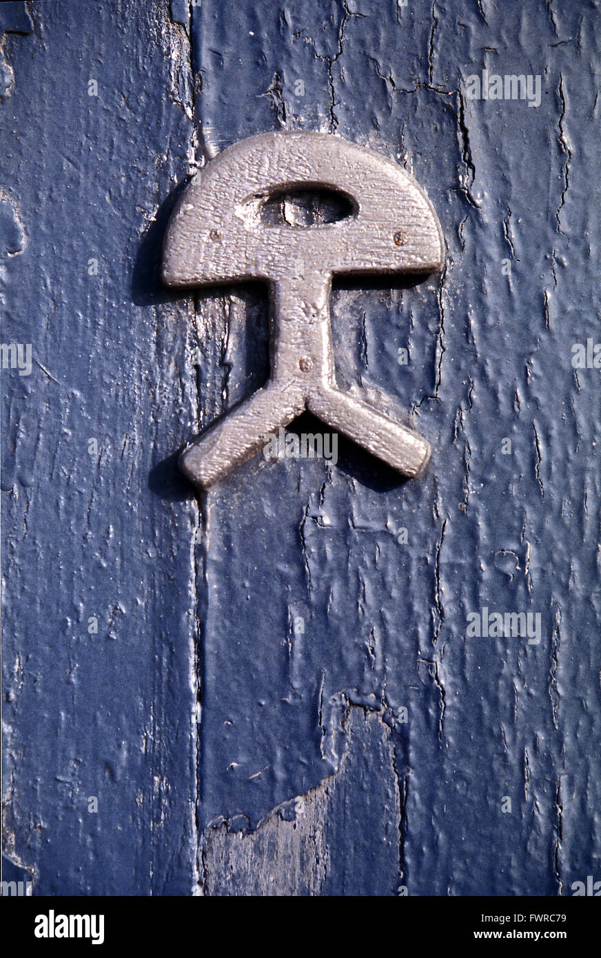 Indalo, antike Idol in einer Tür. Almeria, Andalusien, Spanien. Stockfoto