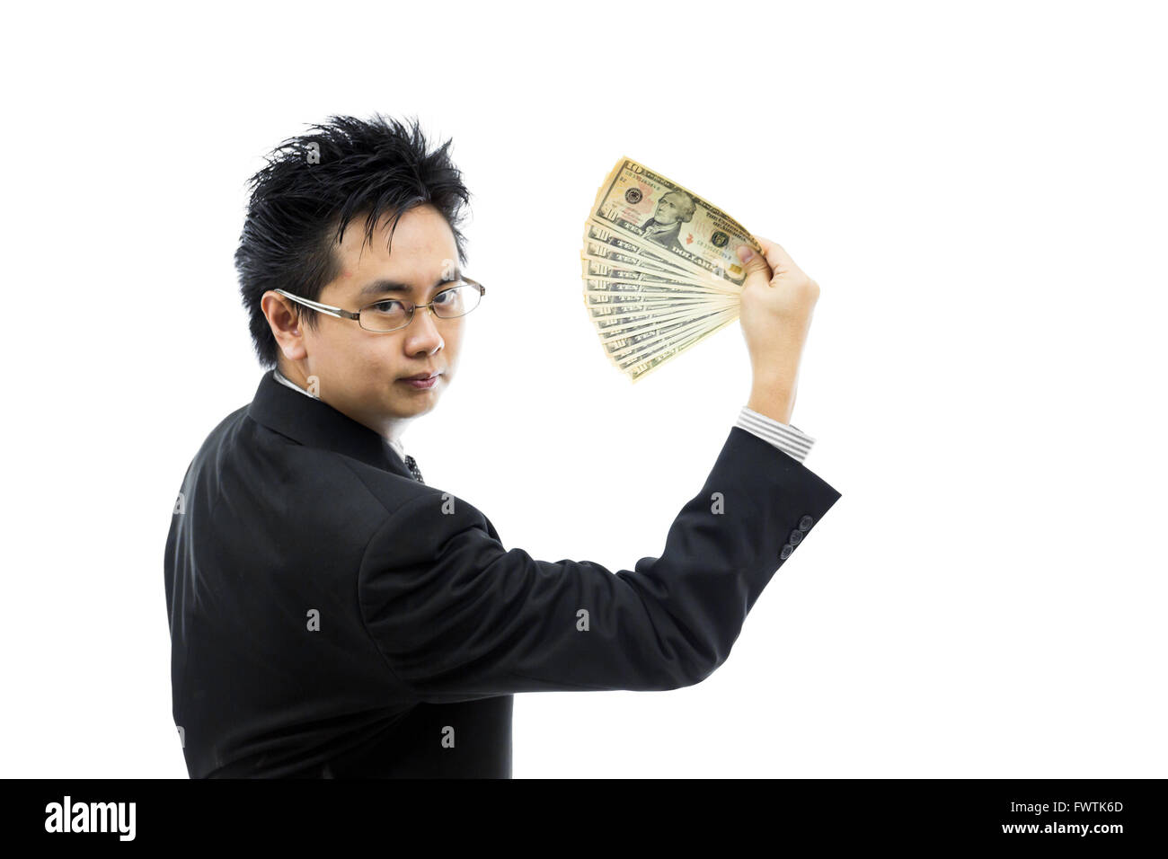 Geschäftsmann hält Geld isoliert auf weißem Hintergrund Stockfoto