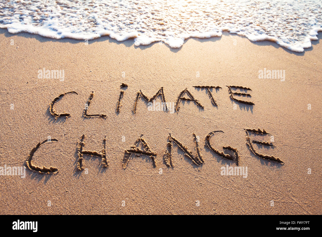 Klima Änderung Konzept, Text, der auf dem sand Stockfoto