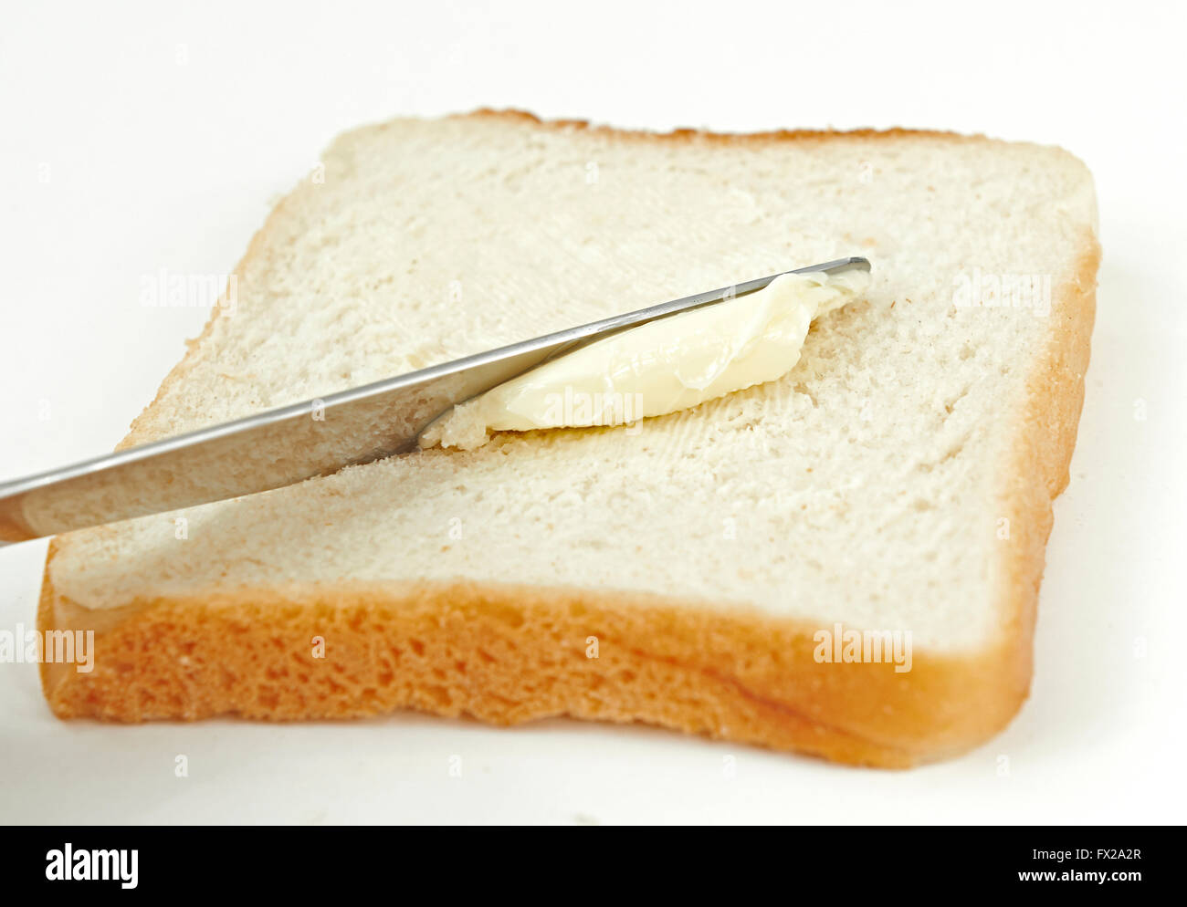 Butter Brot isoliert auf weißem Hintergrund Stockfoto