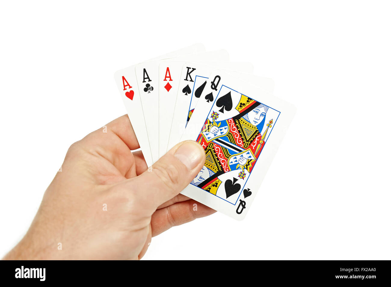Die Hand eines Pokerspielers halten drei einer Art Stockfoto