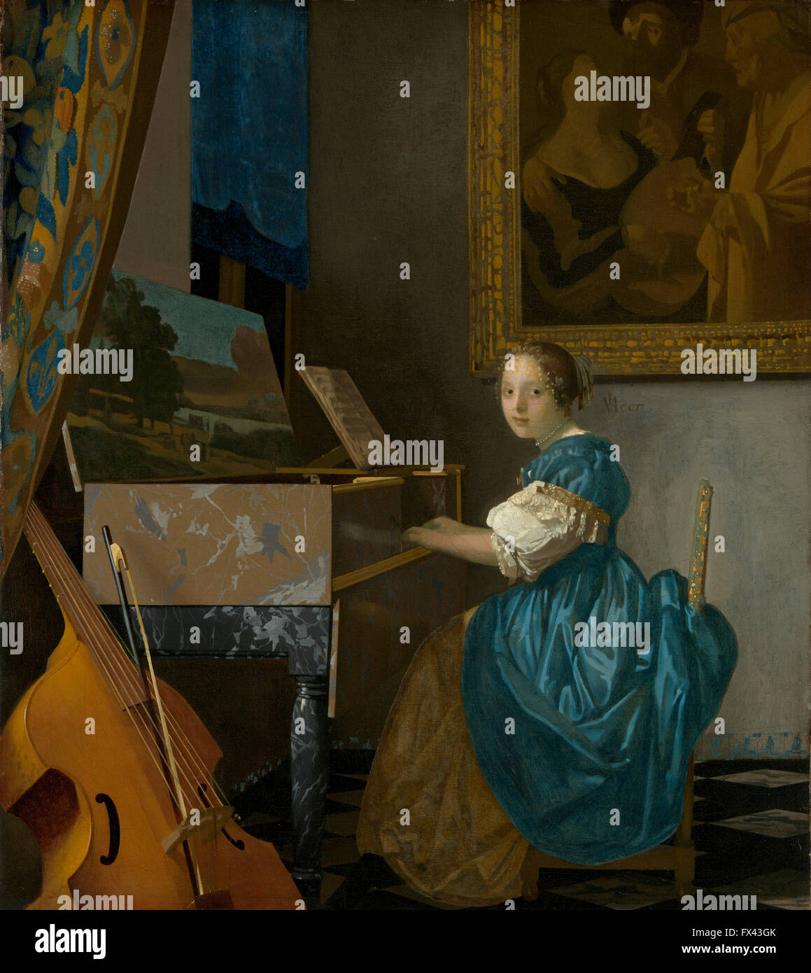 Dame sitzt an einem Virginal von Vermeer Stockfoto