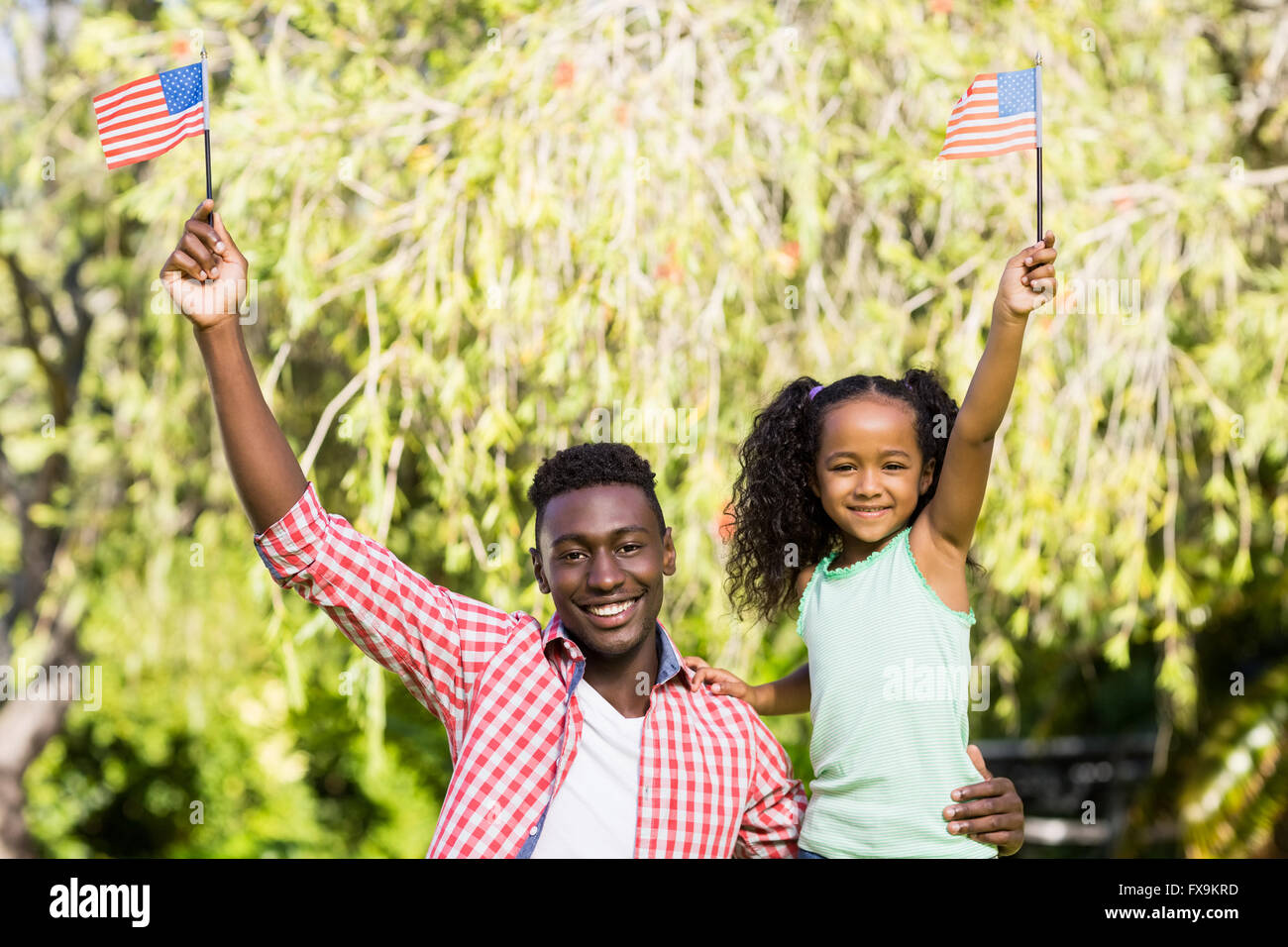 Glückliche Familie mit Usa-Flagge Stockfoto
