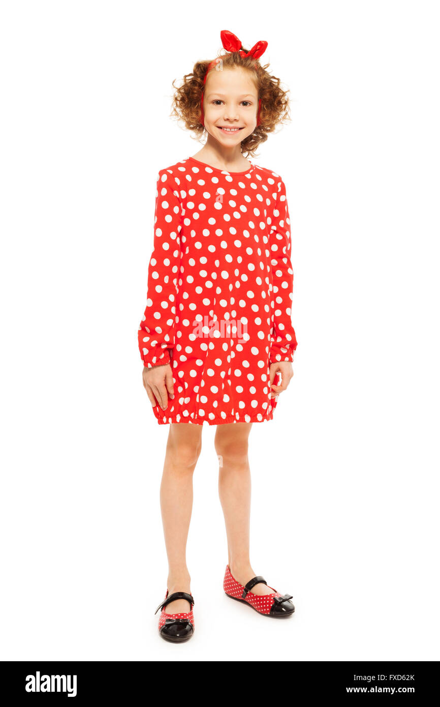 Stilvolle lockige Mädchen in rot gepunkteten Kleid Stockfoto