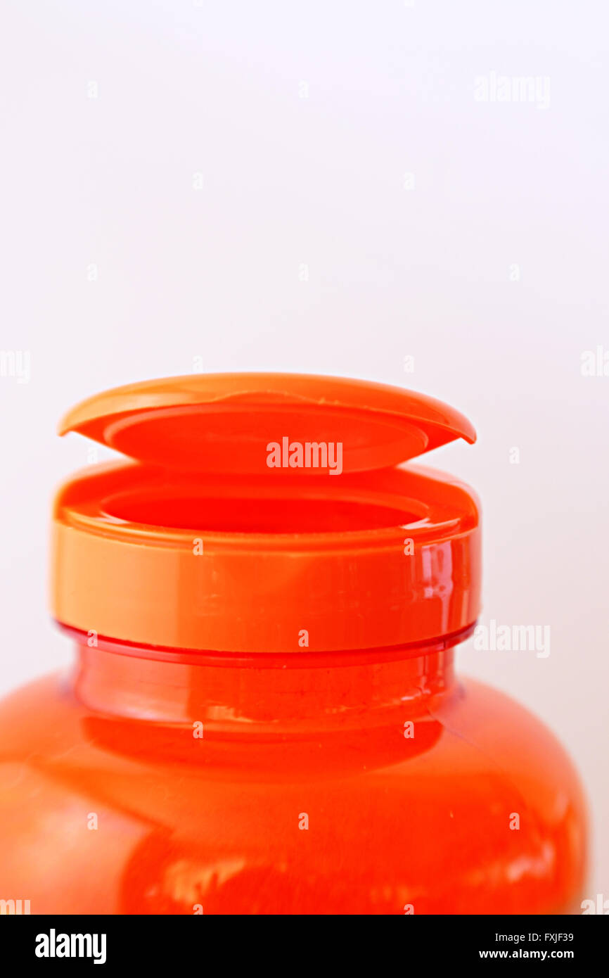 Spitze und Kappe hell orange Kunststoff Pille Flasche Stockfoto