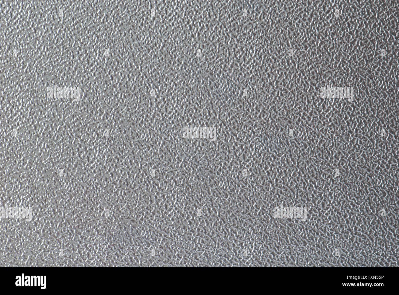 Glänzende, strukturierte Oberfläche einer Metallplatte Stockfoto