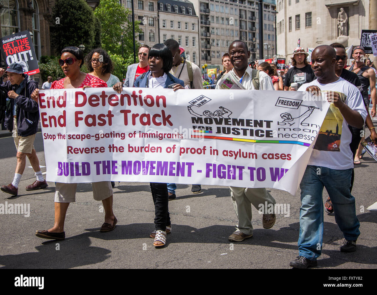 In der Verteidigung von Migranten auf Volksversammlung März / rally "No mehr Sparmaßnahmen" 21. Juni 2014 London Stockfoto