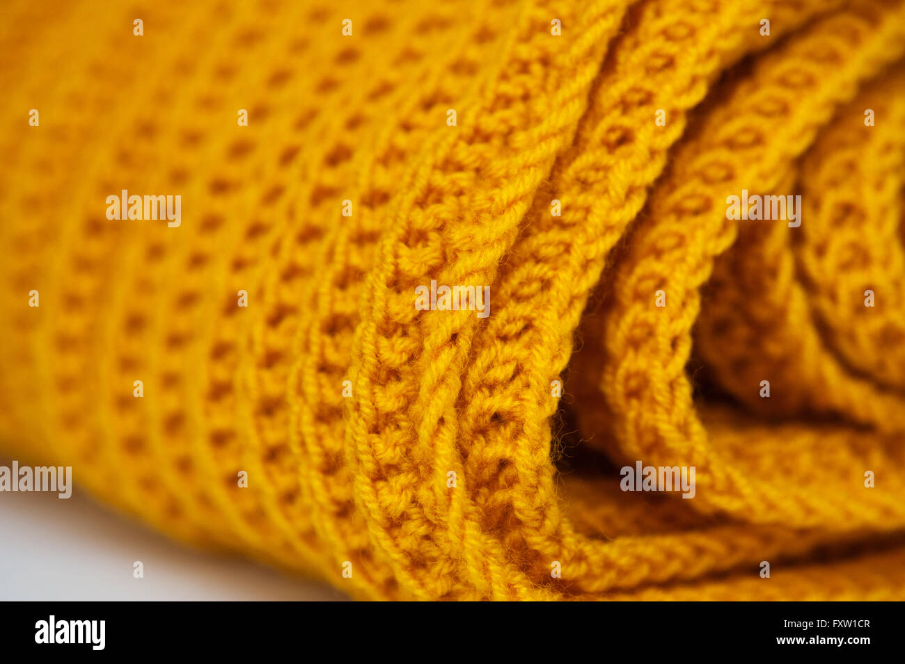 Stoff orange gestrickte Textilhintergrund mit Schal Kleidung Stockfoto