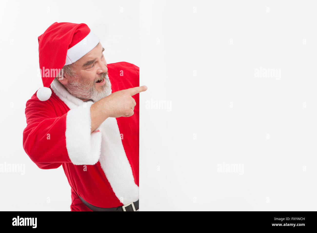 Seite Ansicht Porträt des Weihnachtsmanns auf etwas zeigen Stockfoto