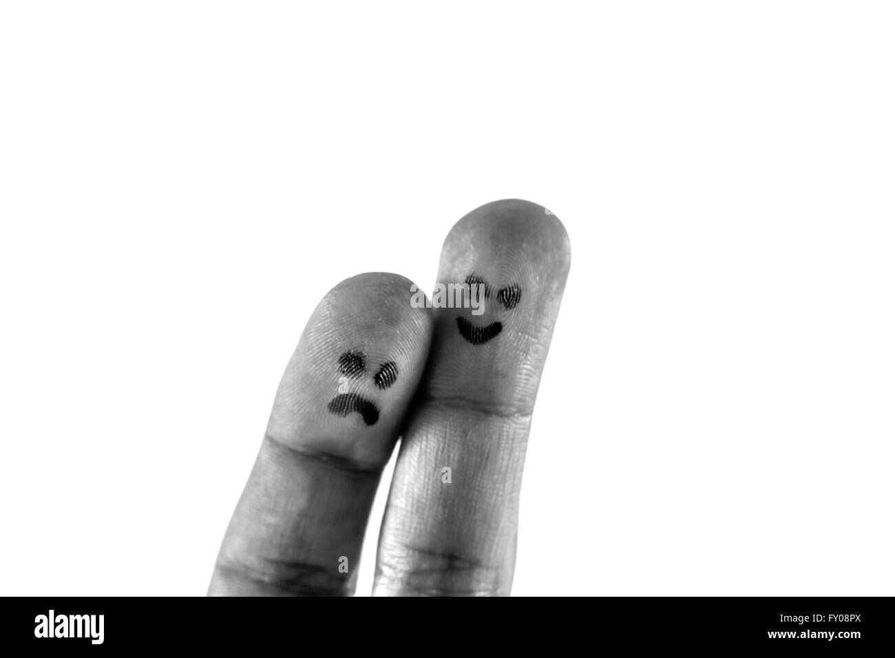 Weißen Hintergrund mit zwei Fingern aus Trauer und Glück Stockfoto